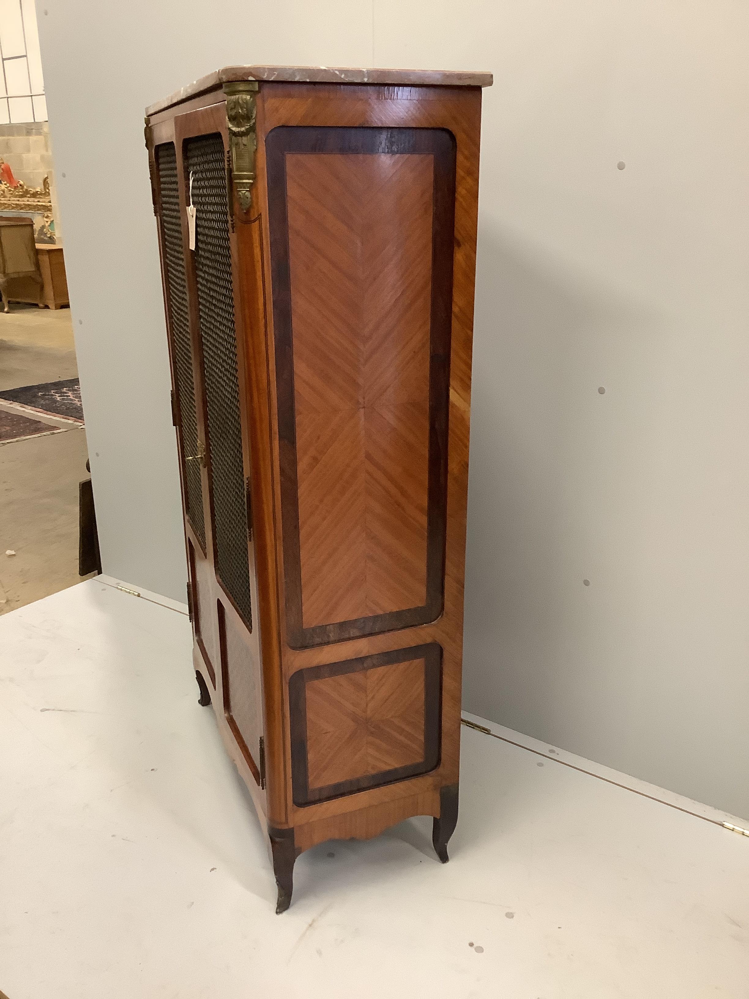 A French transitional style marble topped kingwood side cabinet, width 83cm, depth 40cm, height 145cm